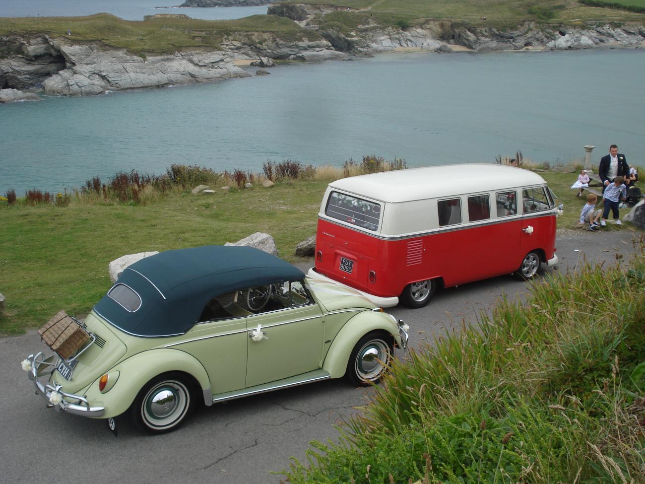 wedding camper and beetle by the coast